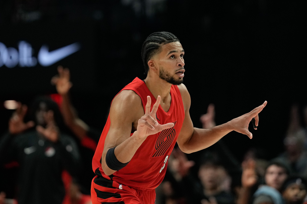 Portland Trail Blazers forward Toumani Camara reacts after shooting a 3-pointer during the first half of an NBA basketball game against the Washington Wizards, Sunday, March 29, 2026, in Portland, Ore. (AP Photo/Jenny Kane)