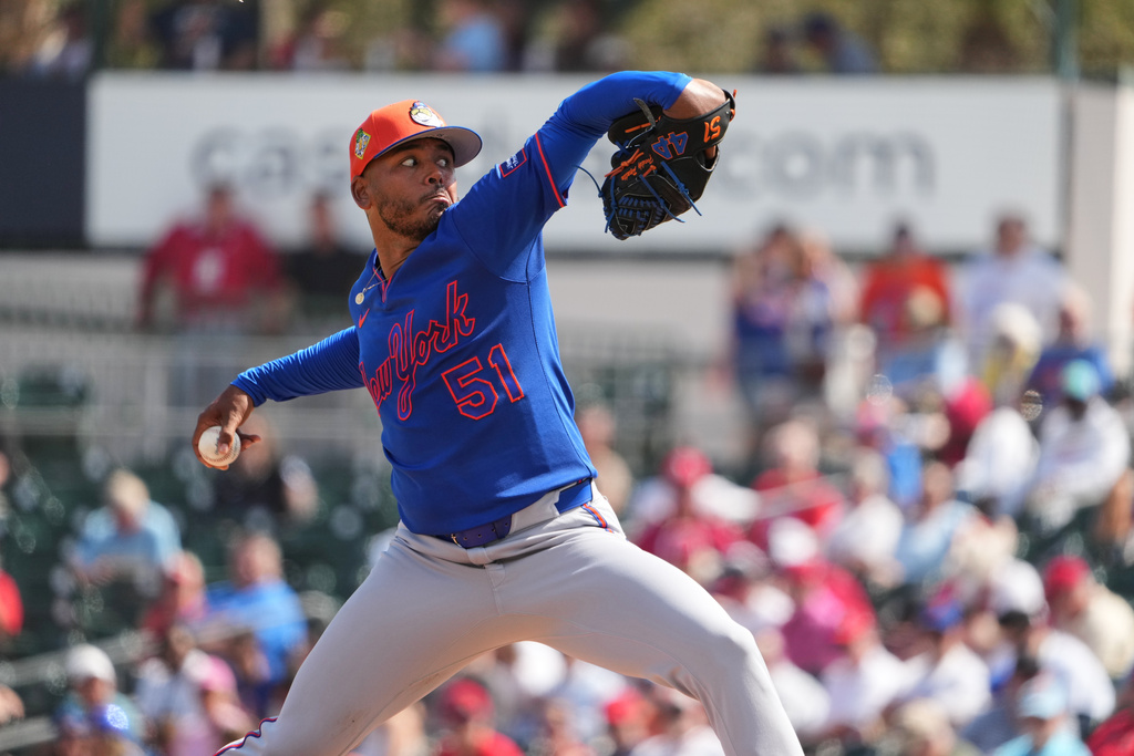 New York Mets starting pitcher Freddy Peralta throws during the third inning of a spring training baseball game against the St. Louis Cardinals Friday, Feb. 27, 2026, in Jupiter, Fla. (AP Photo/Jeff Roberson)