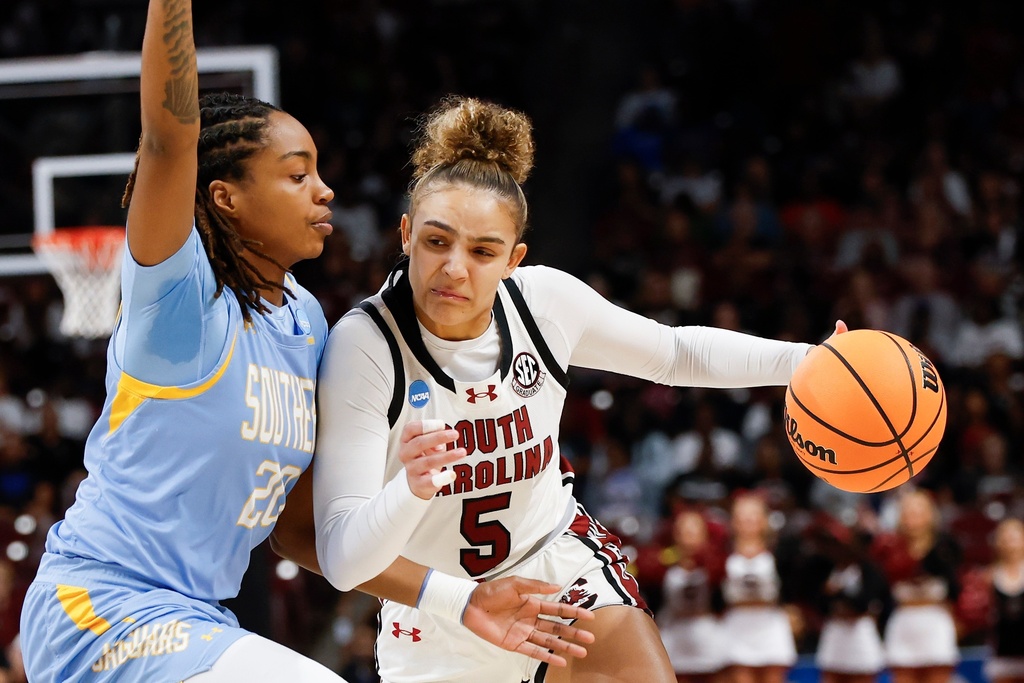 South Carolina guard Tessa Johnson (5) drives against Southern guard Zaria Hurston during the first half of the first round of the NCAA college basketball tournament, Saturday, March 21, 2026, in Columbia, S.C. (AP Photo/Nell Redmond)