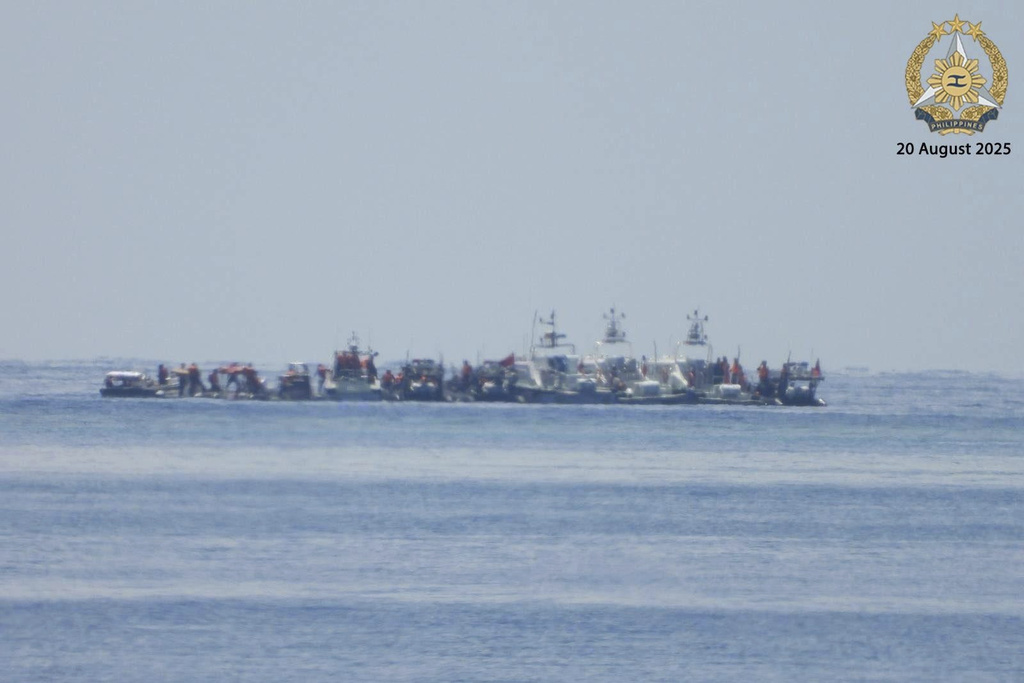 In this photo provided by the Armed Forces of the Philippines, Public Information Office (PAO), Chinese vessels, some mounted with armaments, were observed close to long-grounded Philippine warship BRP Sierra Madre in the vicinity of Second Thomas Shoal at the disputed South China Sea on Wednesday August 20, 2025. (Armed Forces of the Philippines PAO via AP)