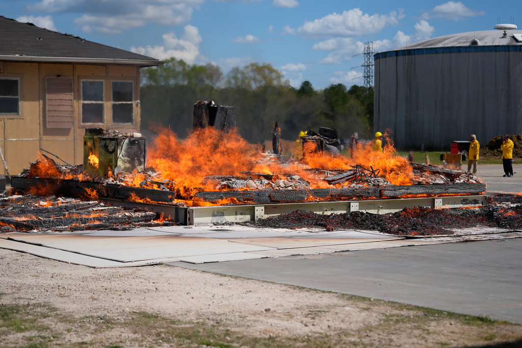 An accessory dwelling unit burns during an experiment at the Institute for Business & Home Safety center Wednesday, April 1, 2026, in Richburg, S.C. (AP Photo/Erik Verduzco)
