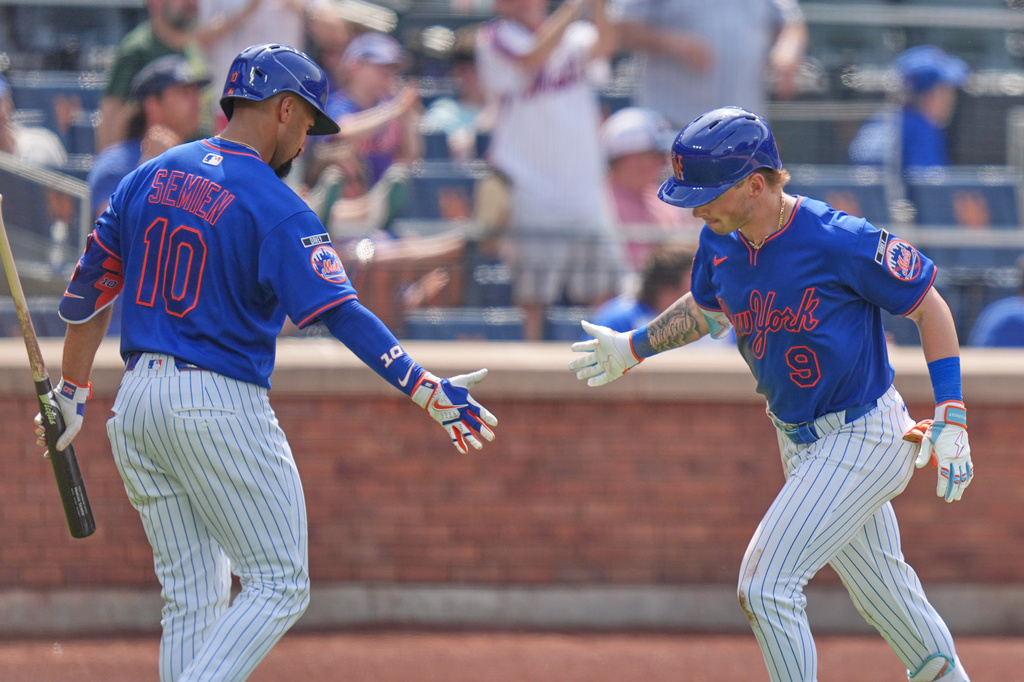 New York Mets' A.J. Ewing, right, celebrates his home run with Marcus Semien during the fifth inning of a baseball game against the Atlanta Braves, Sunday, June 14, 2026, in New York. (AP Photo/Seth Wenig)