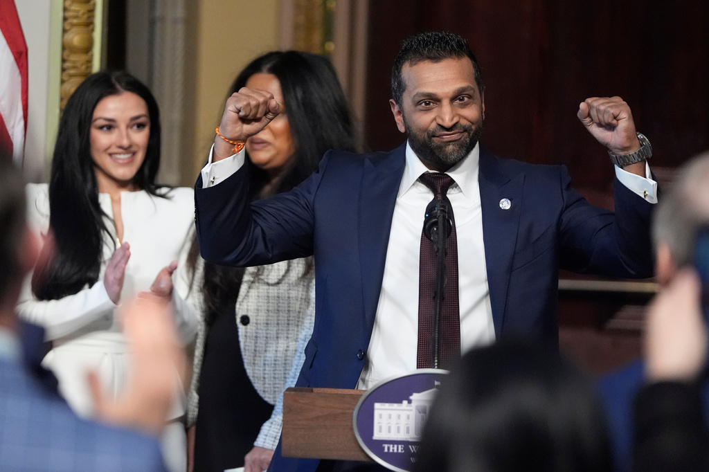 FILE - Kash Patel, President Donald Trump's new director of the FBI, reacts as Alexis Wilkins watches during Patel's ceremonial swearing-in, Friday, Feb. 21, 2025, in the Indian Treaty Room at the Eisenhower Executive Office Building on the White House campus, in Washington. (AP Photo/Mark Schiefelbein, File)