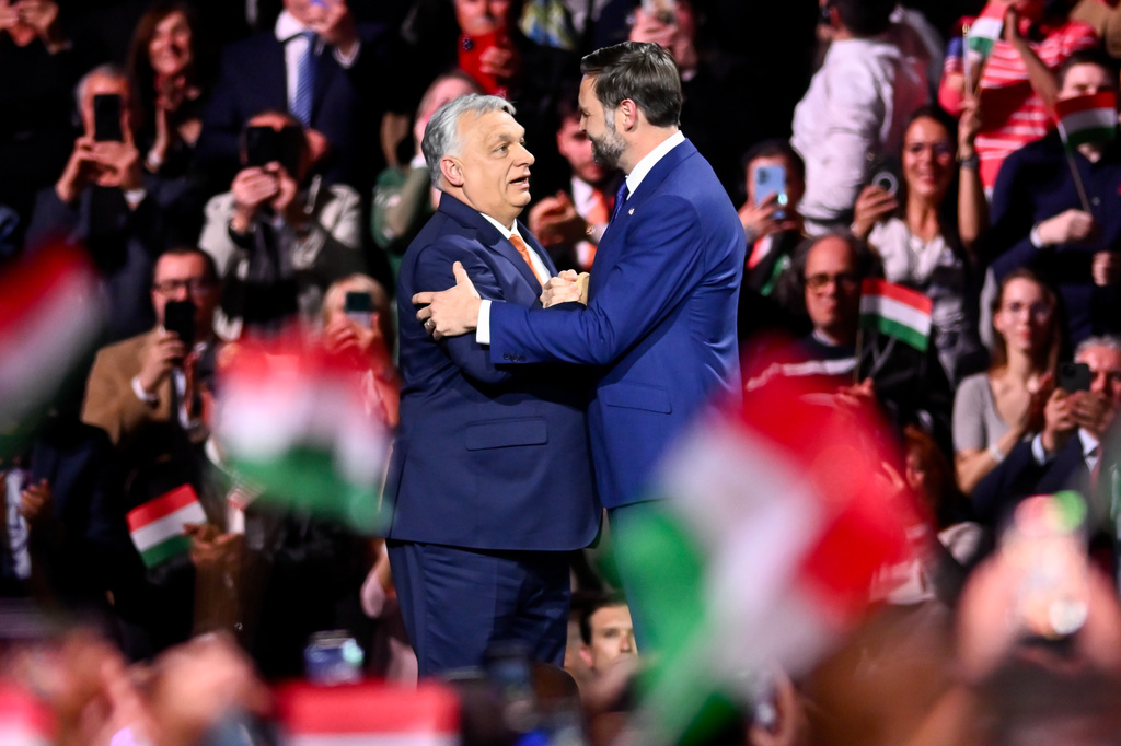 Hungary's Prime Minister Viktor Orban, left, and U.S. Vice President JD Vance shake hands at the end of a pre-election rally in Budapest, Hungary, Tuesday, April 7, 2026. (AP Photo/Denes Erdos)