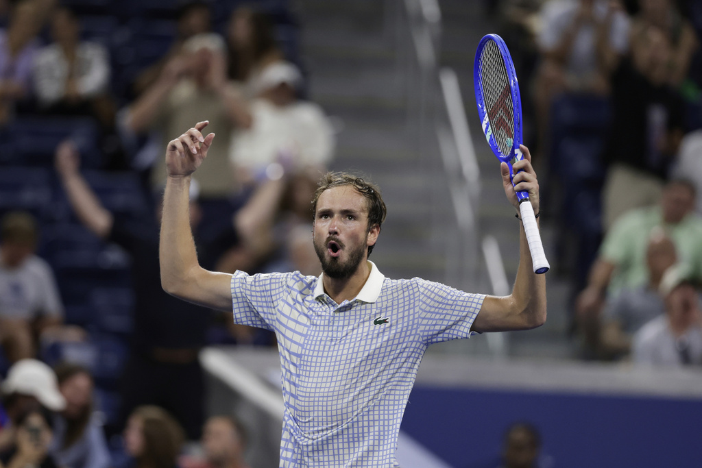 Daniil Medvedev, of Russia, gestures after a photographer ran onto the court during a match against Benjamin Bonzi, of France, in the first-round of the U.S. Open tennis championships, Sunday, Aug. 24, 2025, in New York. (AP Photo/Adam Hunger)