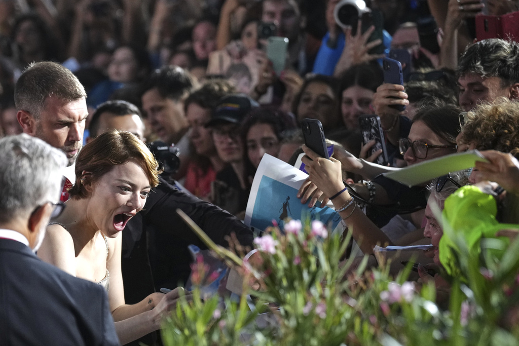 Emma Stone poses for photographers on the red carpet for the film 'Bugonia' during the 82nd edition of the Venice Film Festival in Venice, Italy, on Thursday, Aug. 28, 2025. (Photo by Alessandra Tarantino/Invision/AP)