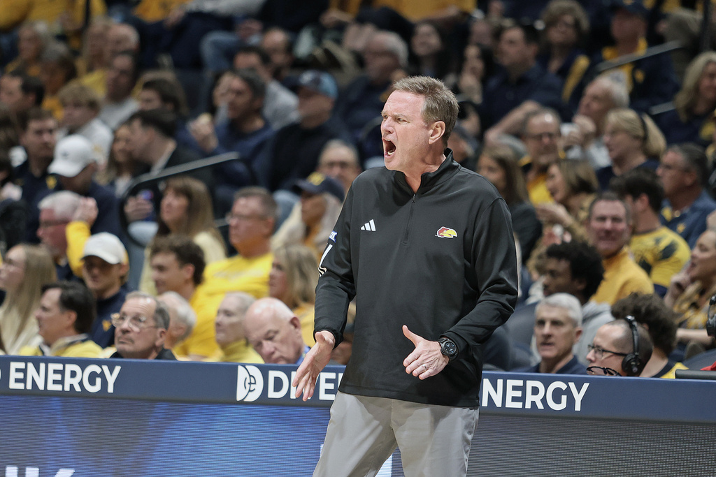 Kansas coach Bill Self reacts during the first half of an NCAA college basketball game against West Virginia Saturday, Jan. 10, 2026, in Morgantown, W.Va. (AP Photo/Kathleen Batten)