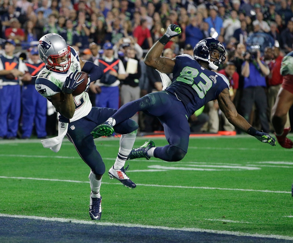 FILE - New England Patriots strong safety Malcolm Butler (21) intercepts a pass intended for Seattle Seahawks wide receiver Ricardo Lockette (83) during the second half of NFL Super Bowl XLIX football game, Feb. 1, 2015, in Glendale, Ariz. (AP Photo/Kathy Willens, File)