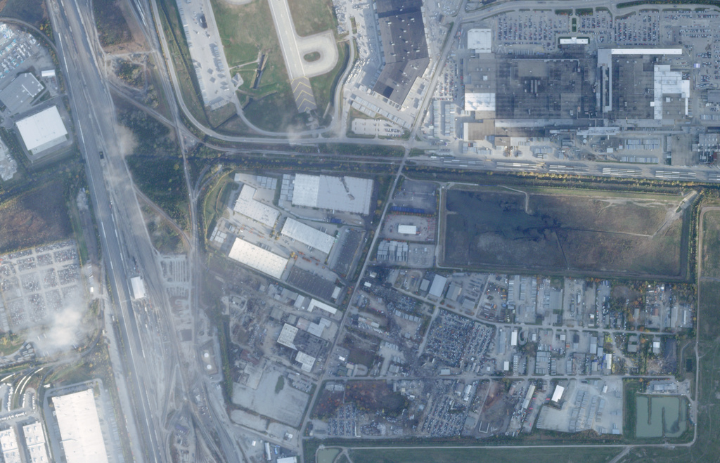 This satellite image from Planet Labs PBC shows the crash site of a UPS McDonnell Douglas MD-11 aircraft just south of Muhammad Ali International Airport, in Louisville, Ky., Monday, Nov. 10, 2025. (Planet Labs PBC via AP)