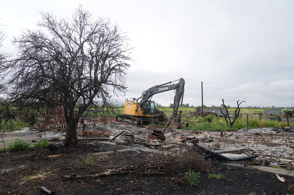 Property damage is shown at the location of a July 1, 2025, fireworks explosion in Esparto, Calif., Friday, April 10, 2026. (AP Photo/Jeff Chiu)