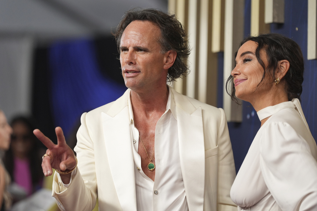 Walton Goggins, left, and Nadia Conners arrive at the 77th Primetime Emmy Awards on Sunday, Sept. 14, 2025, at the Peacock Theater in Los Angeles. (AP Photo/Jae C. Hong)