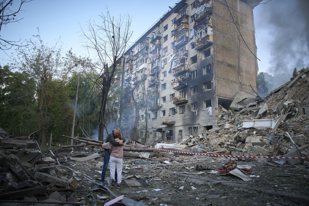 FILE - Residents react after a Russian missile hit a multi-store apartment during Russia's combined missile and drone air attack in Kyiv, Ukraine, June 17, 2025. (AP Photo/Efrem Lukatsky, File)