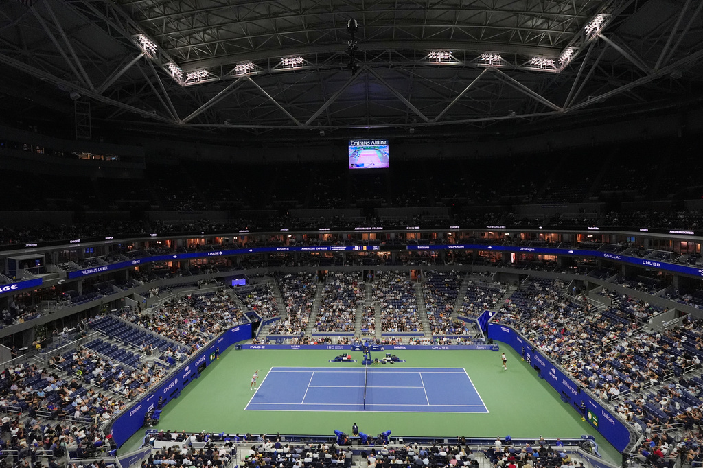 Fans watch Lorenzo Sonego, left, of Italy, play Alexander Zverev, of Germany, in the first round of the U.S. Open tennis championships Tuesday, Sept. 1, 2026, in New York. (AP Photo/Frank Franklin II)