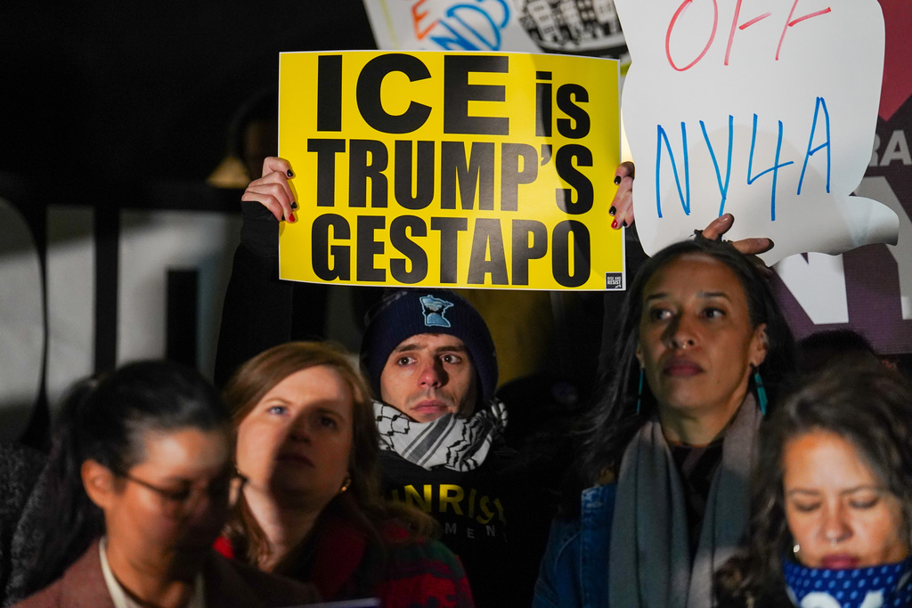 People participate in a protest in response to the fatal shooting of Renee Nicole Good by a Federal immigration officer this morning in Minneapolis, Wednesday, Jan. 7, 2026, in New York. (AP Photo/Ryan Murphy)