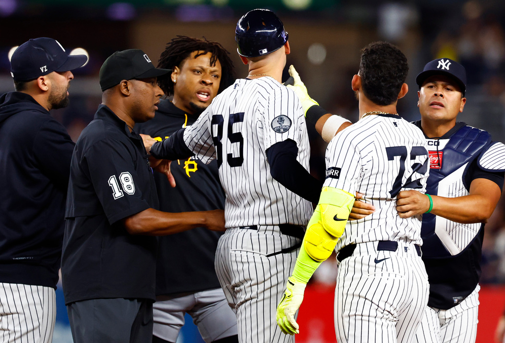 Pittsburgh Pirates' Gregory Soto, left, exchanges words with New York Yankees' José Caballero (72), right, during the ninth inning of a baseball game, Monday, July 20, 2026 in New York. (AP Photo/Noah K. Murray)
