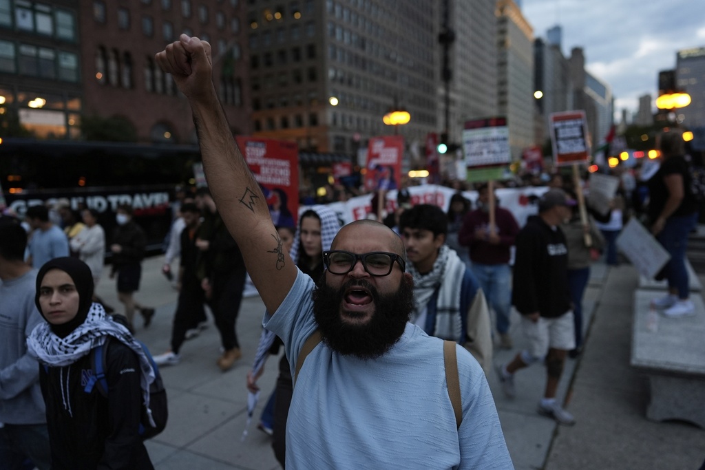 People march during Illinois Coalition for Immigrant & Refugee Rights' "Chicago Says No Trump No Troops" protest Saturday, Sept. 6, 2025, in Chicago. (AP Photo/Carolyn Kaster)