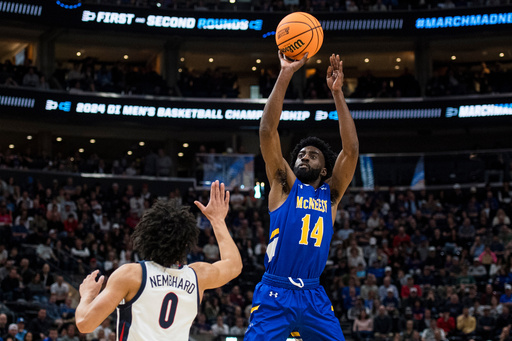 FILE - McNeese State guard Javohn Garcia (14) shoots over Gonzaga guard Ryan Nembhard (0) during the first half of a first-round college basketball game in the NCAA Tournament in Salt Lake City, Thursday, March 21, 2024. (AP Photo/Isaac Hale, File) FILE - McNeese State guard Javohn Garcia (14) shoots over Gonzaga guard Ryan Nembhard (0) during the first half of a first-round college basketball game in the NCAA Tournament in Salt Lake City, Thursday, March 21, 2024. (AP Photo/Isaac Hale, File)