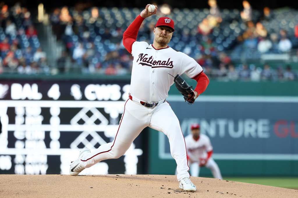Washington Nationals pitcher Cade Cavalli throws during the first inning of a baseball game against the St. Louis Cardinals, Tuesday, April 7, 2026, in Washington. (AP Photo/Daniel Kucin Jr.)