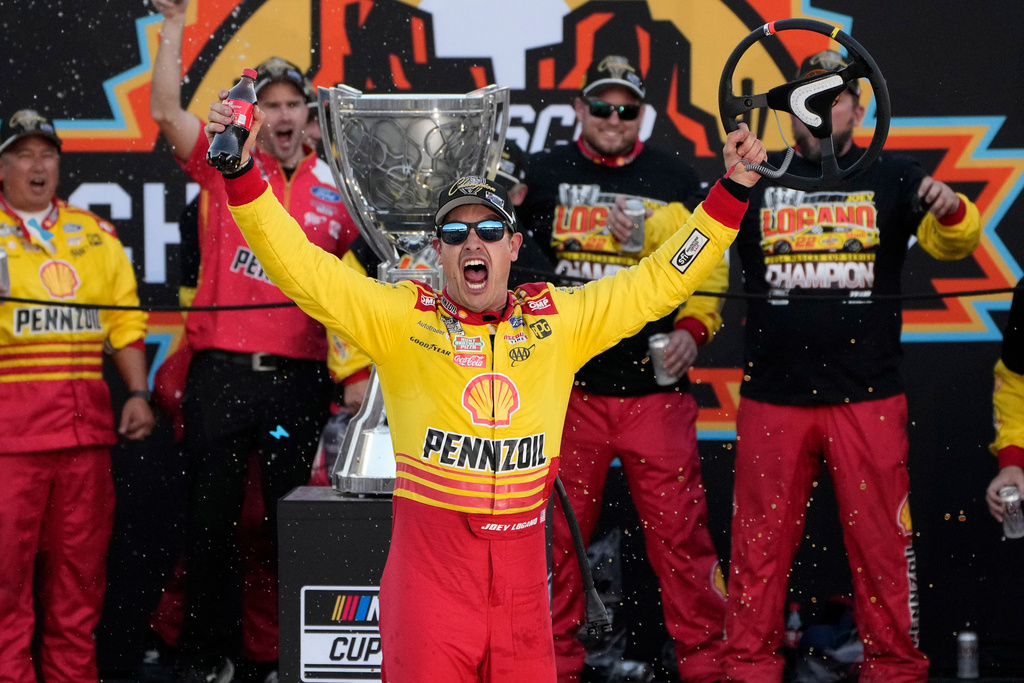 FILE - Joey Logano celebrates after winning a NASCAR Cup Series Championship auto race for the championship at Phoenix Raceway, Sunday, Nov. 10, 2024, in Avondale, Ariz. (AP Photo/John Locher, File)