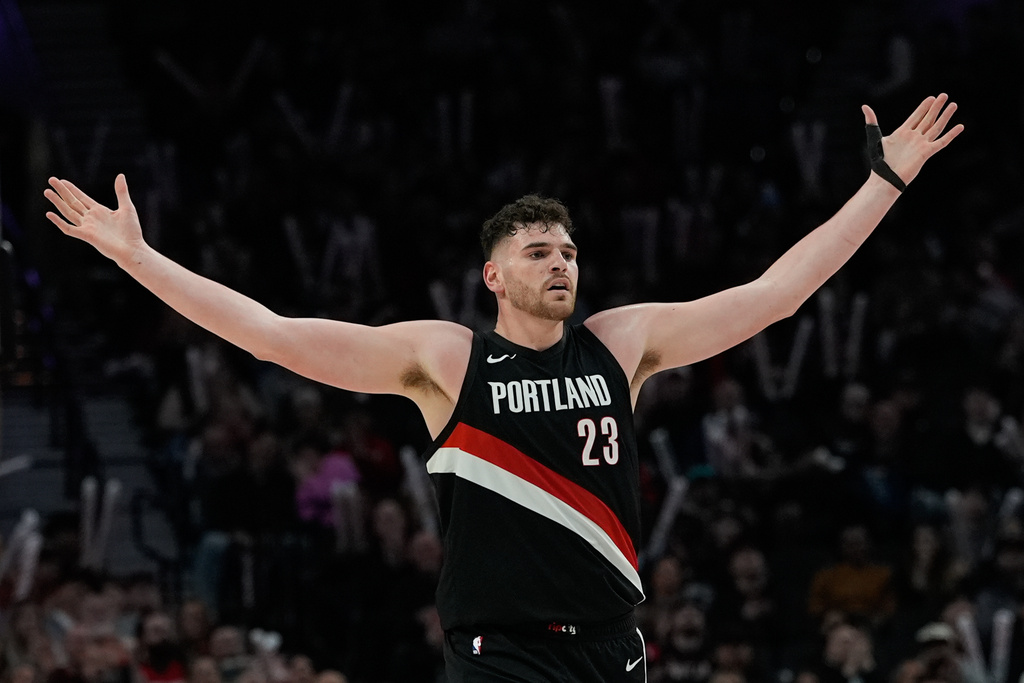 Portland Trail Blazers center Donovan Clingan reacts after the Portland Trail Blazers' scored during the first half of an NBA basketball game against the Utah Jazz, Friday, March 13, 2026, in Portland, Ore. (AP Photo/Jenny Kane)