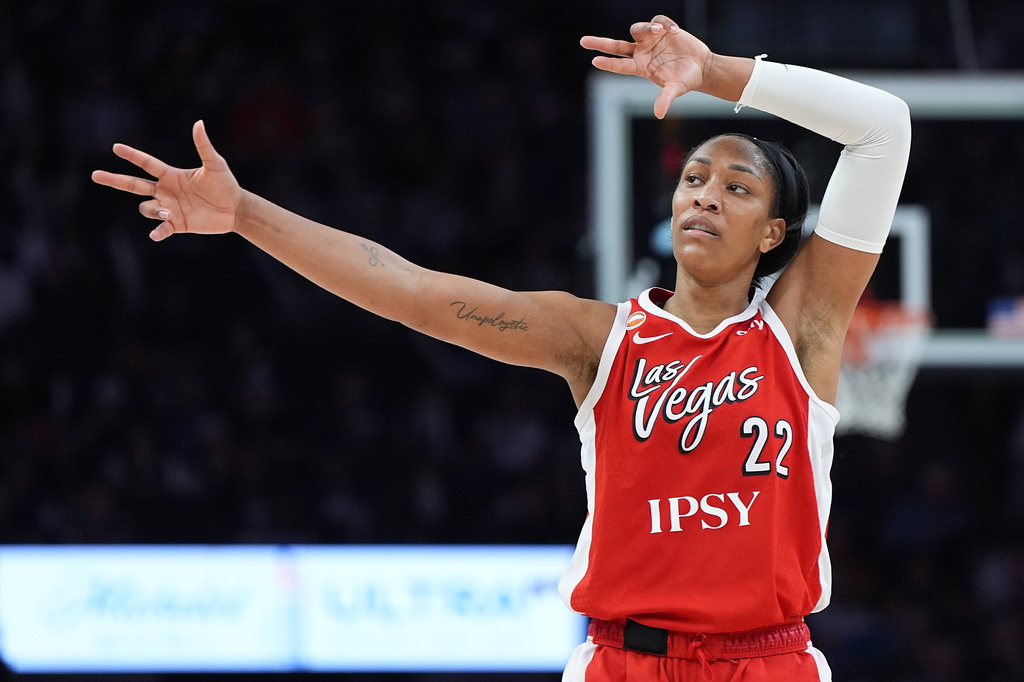 Las Vegas Aces center A'ja Wilson (22) celebrates after making a shot during the second half of a WNBA basketball game against the Minnesota Lynx Saturday, Aug. 8, 2026, in Minneapolis. (AP Photo/Abbie Parr)