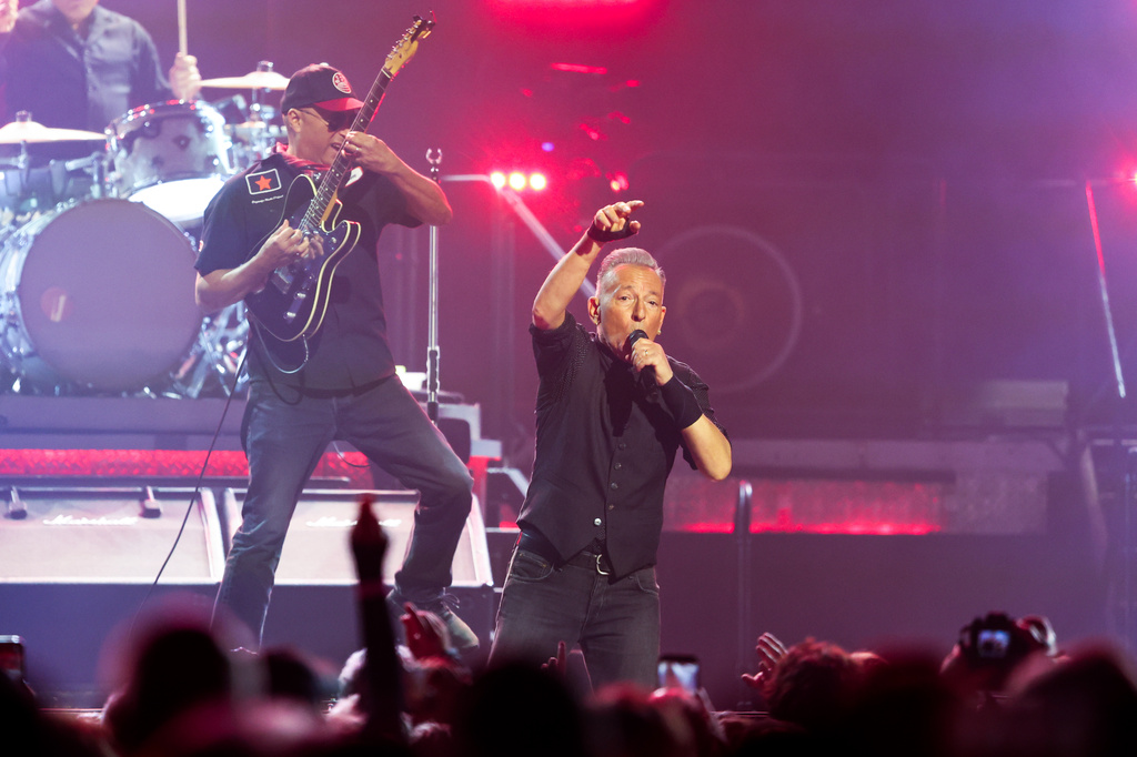Bruce Springsteen, right, of Bruce Springsteen and the E Street Band, and Tom Morello perform on opening night of the "Land of Hope And Dreams" tour at Target Center in Minneapolis. (AP Photo/Ellen Schmidt) CORRECTION: Name of person shown on left corrected to Tom Morello instead of Steven Van Zandt