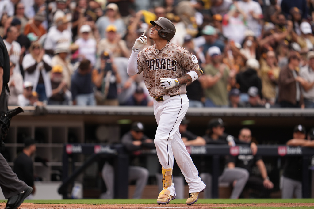 San Diego Padres' Manny Machado celebrates his home run during the fourth inning of a baseball game against the Chicago White Sox Sunday, May 3, 2026, in San Diego. (AP Photo/Gregory Bull)