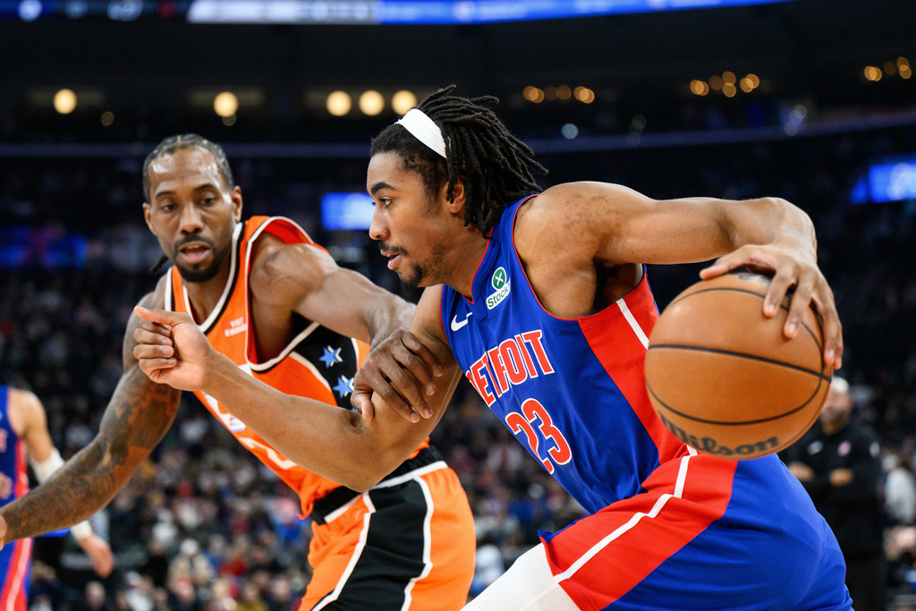 Detroit Pistons guard Jaden Ivey (23) drives the ball while under pressure from Los Angeles Clippers forward Kawhi Leonard during the first half of an NBA basketball game, Sunday, Dec. 28, 2025, in Inglewood, Calif. (AP Photo/William Liang)