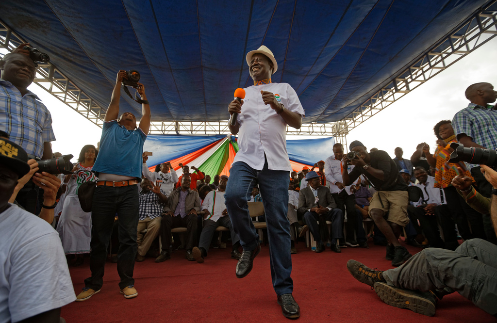 Kenyan opposition leader Raila Odinga dances to music at a rally attended by thousands of supporters in the Shauri Moyo area of Nairobi, Kenya Wednesday, Oct. 18, 2017. (AP Photo/Ben Curtis)