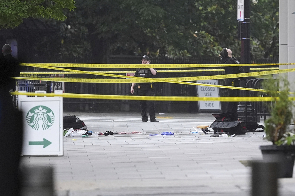 An EMS kit and gloves are pictured on the ground where police and Secret Service blocked streets around the White House, Saturday, May 23, 2026, in Washington. (AP Photo/Alex Brandon)