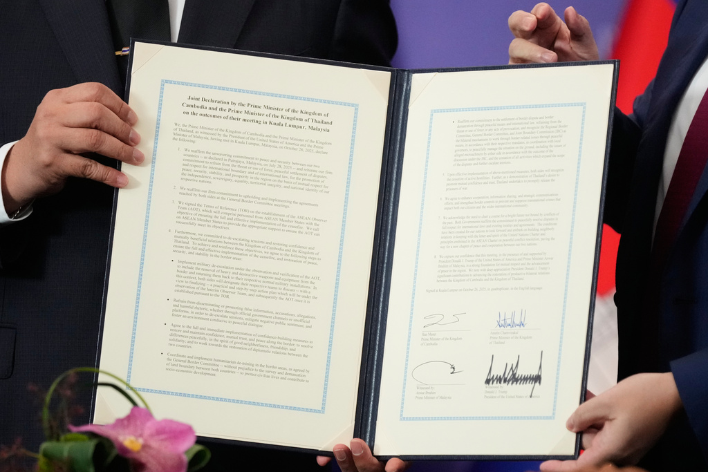 The document signed by Cambodian Prime Minister Hun Manet and Thailand's Prime Minister Anutin Charnvirakul, left, on the sidelines of the ASEAN Summit in Kuala Lumpur, Malaysia, Sunday, Oct. 26, 2025. (AP Photo/Mark Schiefelbein)