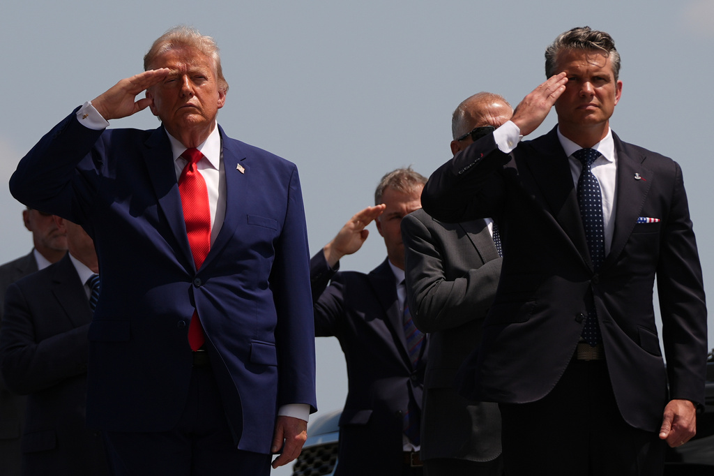 President Donald Trump and Defense Secretary Pete Hegseth salute as a U.S. Army carry team moves a transfer case containing the remains of Pvt. Isabella Gonzales of Carrollton, Texas, Wednesday, July 22, 2026, at Dover Air Force Base, Del. (AP Photo/Julia Demaree Nikhinson)