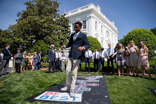 FILE - Invited guests play at the Jacqueline Kennedy Garden as part of a one year anniversary event for first lady Melania Trump's Be Best initiative, May 7, 2019, at the White House in Washington. (AP Photo/Andrew Harnik, File) FILE - Invited guests play at the Jacqueline Kennedy Garden as part of a one year anniversary event for first lady Melania Trump's Be Best initiative, May 7, 2019, at the White House in Washington. (AP Photo/Andrew Harnik, File)
