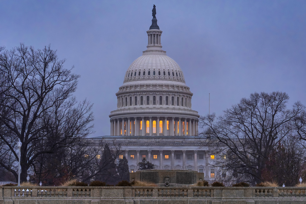 The Capitol is seen during heavy rain as the Department of Homeland Security funding bill remains in limbo, in Washington, Friday, Feb. 20, 2026. (AP Photo/J. Scott Applewhite)
