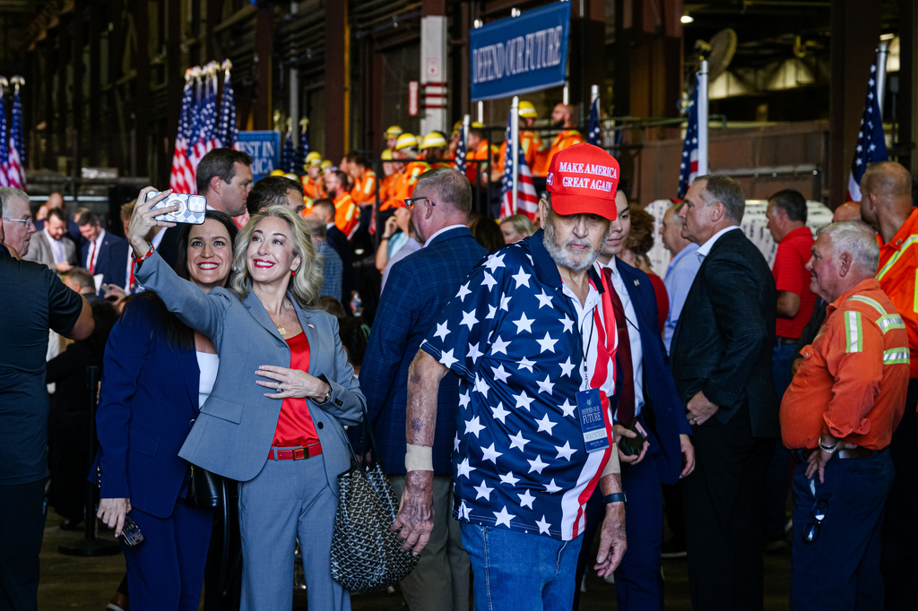 Attendees are seen ahead of a visit from Vice President JD Vance at Cleveland Cliffs Middletown Works, Friday, Aug. 21, 2026, in Middletown, Ohio. (AP Photo/Jon Cherry)