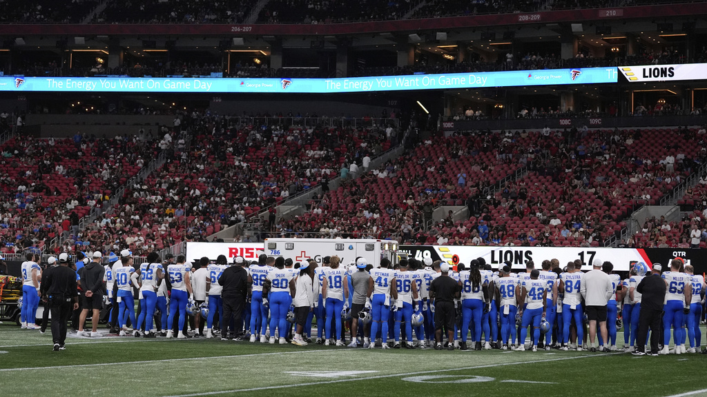Detroit Lions players stand on the field after safety Morice Norris was injured during the second half of an NFL preseason football game against the Atlanta Falcons Friday, Aug. 8, 2025, in Atlanta. (AP Photo/Brynn Anderson)