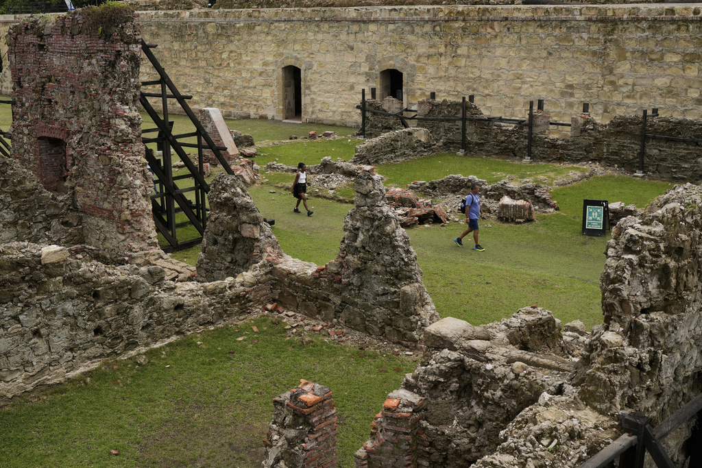 Visitors tour Fort San Lorenzo, a 16th-century Spanish fortress guarding the mouth of the Chagres River, once the main colonial waterway linking the Pacific and Caribbean, in Colon, Panama, Tuesday, Aug. 12, 2025. (AP Photo/Matias Delacroix)
