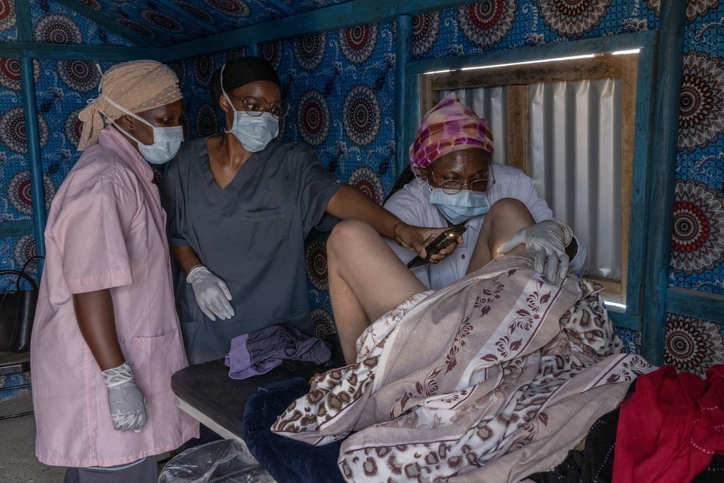 A young Malian woman is treated for her dangerously high fever and infection by doctors at the Douankara health clinic in the Hodh El Chargui Region, Mauritania, Nov. 7, 2025. (AP Photo/Caitlin Kelly)