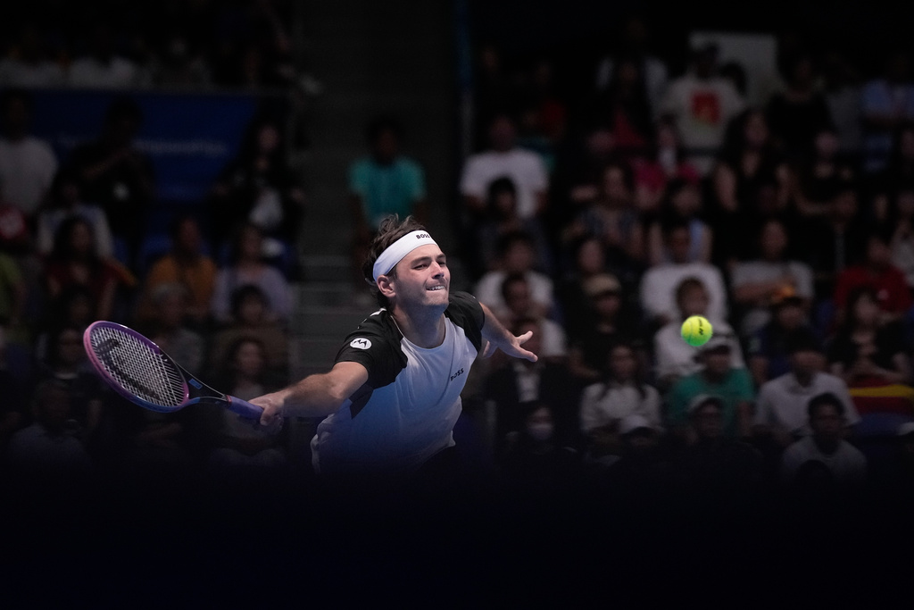 United States' Taylor Fritz plays a shot against Spain's Carlos Alcaraz during the men's final match at the Tokyo ATP 500 tennis tournament at Ariake Coliseum, in Tokyo, Japan, Tuesday, Sept. 30, 2025. (AP Photo/Louise Delmotte)