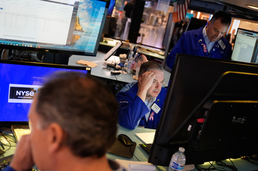 James Bodner, center, and others work on the floor at the New York Stock Exchange in New York, Wednesday, Oct. 1, 2025. (AP Photo/Seth Wenig) James Bodner, center, and others work on the floor at the New York Stock Exchange in New York, Wednesday, Oct. 1, 2025. (AP Photo/Seth Wenig)