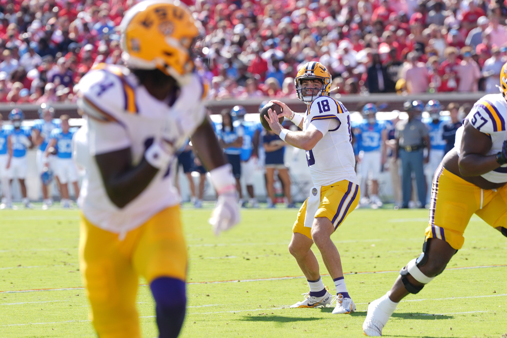 LSU quarterback Garrett Nussmeier (18) attempts a pass downfield during the first half of an NCAA college football game against Mississippi in Oxford, Miss., Saturday, Sept. 27, 2025. (AP Photo/Rogelio V. Solis)