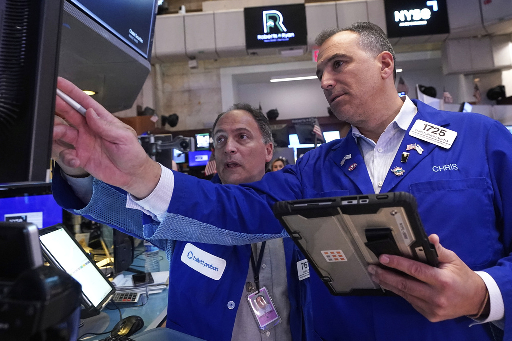 Traders James Conti, left and Christopher Lagana work on the floor of the New York Stock Exchange, Wednesday, Sept. 17, 2025. (AP Photo/Richard Drew)