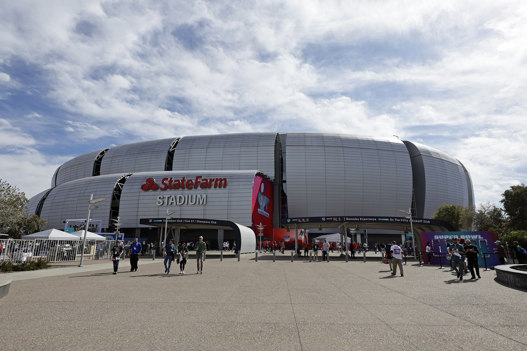 FILE - The exterior of State Farm Stadium is seen before the NFL Super Bowl 57 football game in Glendale, Ariz., on Sunday, Feb. 12, 2023. (AP Photo/Adam Hunger, File)