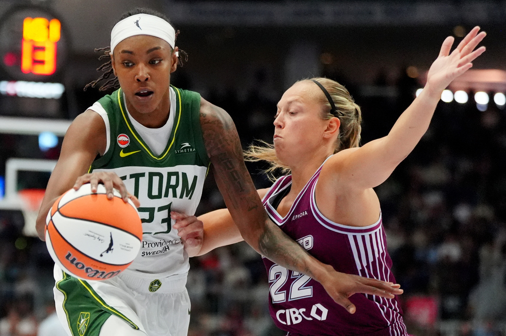 Toronto Tempo guard Julie Allemand, right, defends against Seattle Storm forward Jordan Horston during the first half of a WNBA basketball game in Toronto, Saturday, May 30, 2026. (Frank Gunn/The Canadian Press via AP)