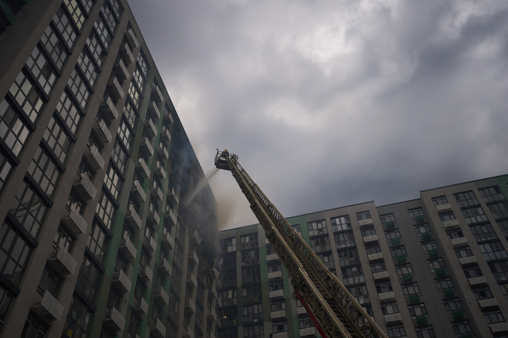 Firefighters work after a Russian drone attack struck a residential building in Kyiv, Tuesday, Sept. 1, 2026. (AP Photo/Francisco Seco)