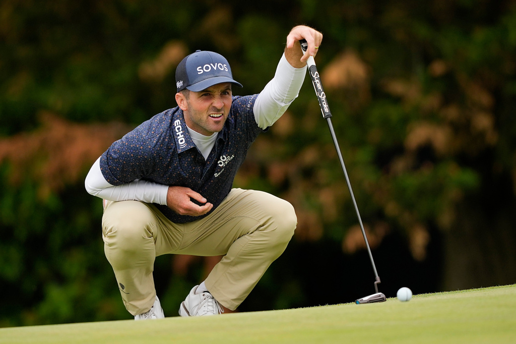 Denny McCarthy lines up his putt on the 12th green during the second round of the PGA Championship golf tournament at Aronimink Golf Club, Friday, May 15, 2026, in Newtown Square, PA. (AP Photo/Carolyn Kaster)