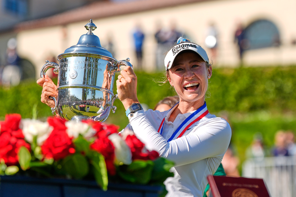 Nelly Korda holds up the trophy after winning the U.S. Women's Open golf tournament Sunday, June 7, 2026, in the Pacific Palisades area of Los Angeles. (AP Photo/Ashley Landis)