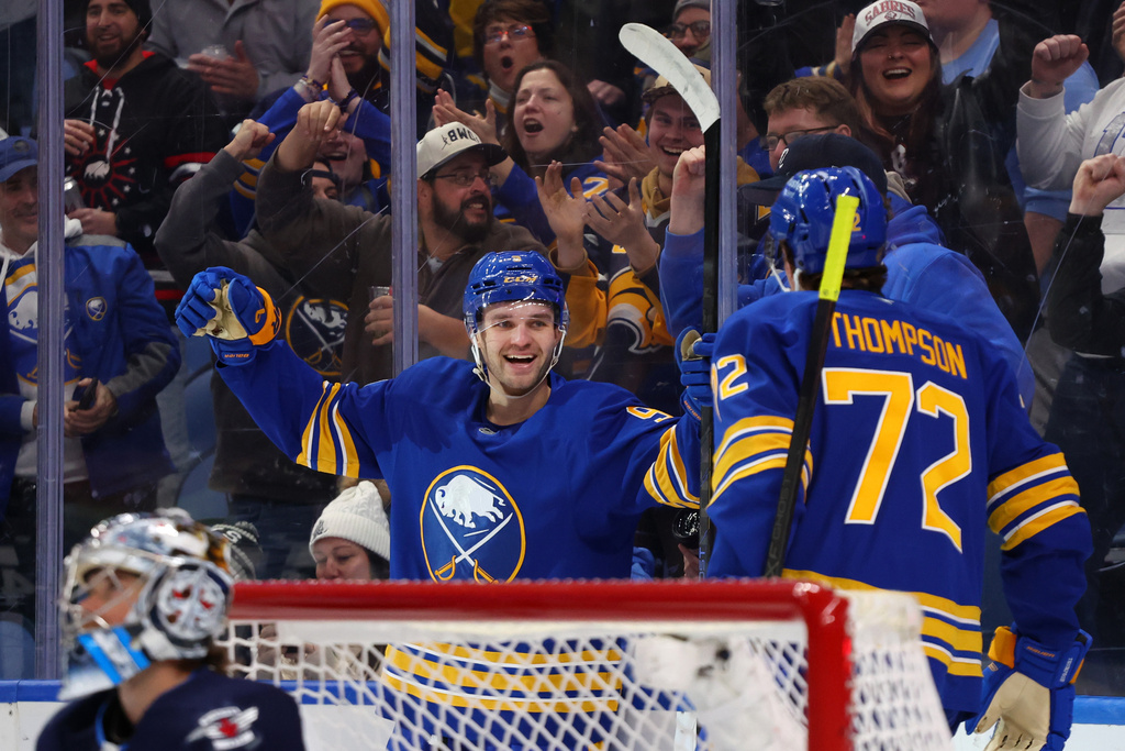 Buffalo Sabres center Josh Norris (9) celebrates his goal with center Tage Thompson (72) during the first period of an NHL hockey game against the Winnipeg Jets, Monday, Dec. 1, 2025, in Buffalo, N.Y. (AP Photo/Jeffrey T. Barnes)