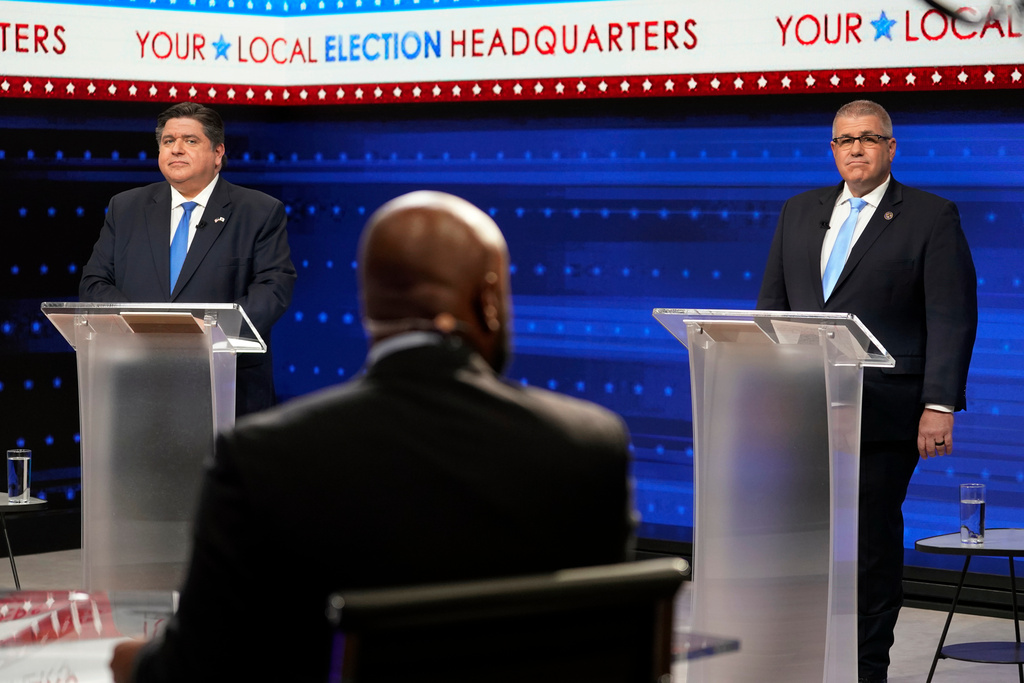 FILE - Illinois Gov. JB Pritzker, left, and Republican gubernatorial challenger state Sen. Darren Bailey participate in the Illinois Governor's Debate at the WGN9 studios, Oct. 18, 2022, in Chicago. (AP Photo/Charles Rex Arbogast, File)