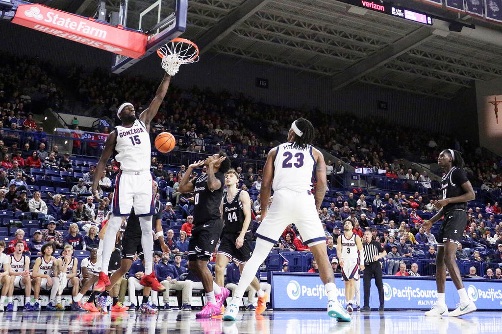 Gonzaga forward Graham Ike (15) dunks during the second half of an NCAA college basketball game against Santa Clara, Thursday, Jan. 8, 2026, in Spokane, Wash. (AP Photo/Young Kwak)